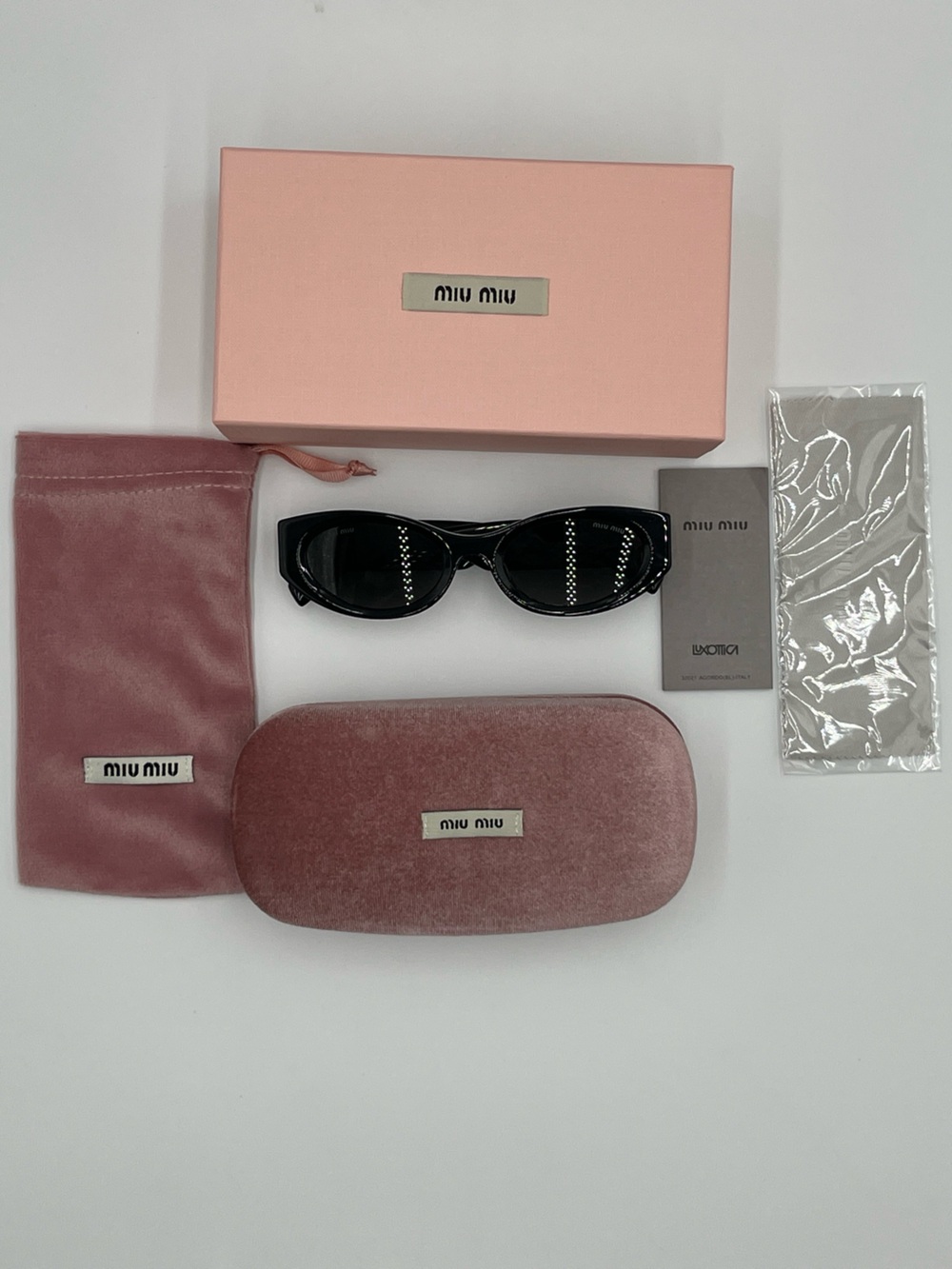 Miu Miu SMU 11W Oval Black Sunglasses with Gold Logo